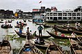 Bangladeshis on canoes. Dhaka by Steve Evans