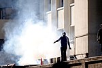 A protester braving Tear Gas near the AUC during the June 28.