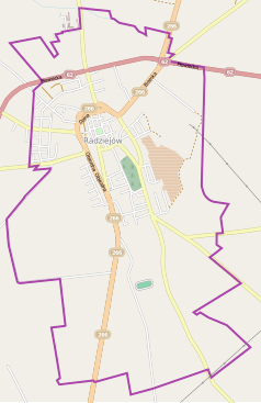 Mapa konturowa Radziejowa, blisko centrum u góry znajduje się punkt z opisem „Parafia Wniebowzięcia Najświętszej Maryi Panny”