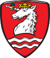 Gemeinde Schondorf a.Ammersee In Rot über zwei silbernen Wellenleisten der silberne Rumpf eines golden gekrönten Einhorns mit blaugesteintem goldenem Ring am Horn.