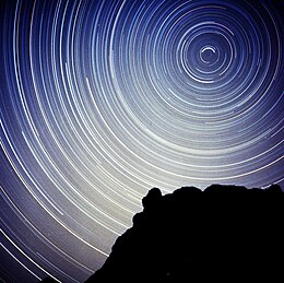 The North Star and circumpolar stars in a photograph with a long shutter speed of several hours. Note that the stars near the celestial pole make less of a trail with the long exposure