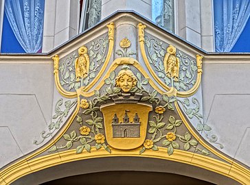 Bay window ornament with a woman head and Bydgoszcz coat of arms