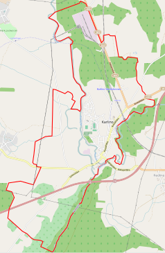 Mapa konturowa Karlina, blisko centrum na dole znajduje się ikonka zamku z wieżą z opisem „Zamek Biskupów Kamieńskich w Karlinie”