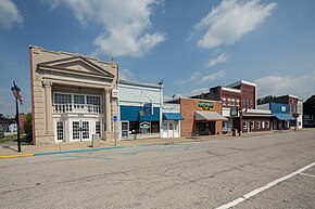 Row of buildings along east side of town square. Owensville Town Hall is on far left.