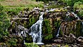 a view of a picnic above the upper cascade of the Loup of Fintry waterfalls