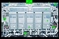 One of the four Controller Panel Assemblies (CPA) bolted to a hatch beam during STS-102 in 2001. Each CPA has one Capture Latch controller (1), four Powered Bolt controllers (2) and circuitry to condition input power (3). A bracket (4) for installation of the M/D "center section" cover is visible on either side of the CPA. The photograph was taken from the PCBM side of the mated vestibule, looking back into the ACBM. The basic individual controller design is also used for the Carbon Dioxide Removal Assembly's Pump Fan Motor Controller, Vent and Relief Valve, and Internal Thermal Control System valves.[6][121]