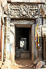 Lintel above the north door: Krishna taming horses [5] whilst standing on kala