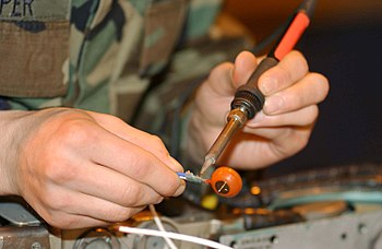 San Diego (Jan. 4, 2007) Navy Diver 1st Class Josh Moore welds a repair patch on the submerged bow of amphibious transport dock USS Ogden (LPD 5) while the ship was in port at Naval Base San Diego.