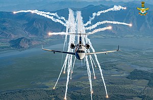 A DRDO Netra in flight, deploying flares