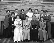 A group of white women, posed in rows and photographed for a 1914 yearbook.