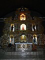 The high altar and main retablo of Saint Mary Magdalene Church