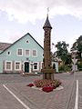 A roofed pole in the Švėkšna town center