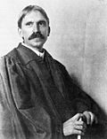 John Dewey, seated, 1902