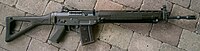 SIG SG 550 assault rifle, laying on the ground oriented right