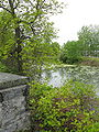 Moat around Fort Lennox. On the left is the top of a chimney above a kitchen located in Fort Lennox.