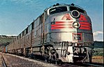 Postcard photo of a Burlington EMD E5 locomotive pulling a freight train in Colorado in 1967