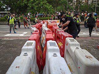 Stand-off between protesters and police in Tai Po