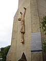 Crucifixion (modern) omitting representation of cross (cf. ancient door of Santa Sabina)