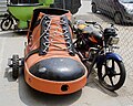 A motorcycle with a shoe shaped side car