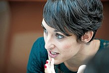 Profile photo of a young woman with short brown hair