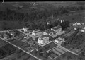 Historisches Luftbild des Kreisspitals Rüti ZH, aufgenommen vom 27. September 1934 von Walter Mittelholzer