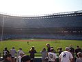 Main grandstand behind home plate during the day.