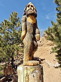 Crude carving of baldheaded "Bigfoot" with beard and Fu Manchu moustache at the Crystal Creek Reservoir in Colorado; note his pearly whites and the pontoon feet. This one really kills me.