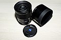 Sony A Zeiss 135mm f1.8 ZA lens with lens cap and SH0003 lens hood