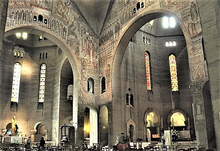 The transept with frescoes by Untersteller and windows by Maumejean