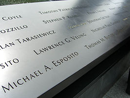 At the South Pool of the National September 11 Memorial, Panel S-7 is one of the three on which names of Squad Company 1 members can be seen. Visible in the photo are those of Michael A. Esposito and Thomas M. Butler along the bottom of the panel