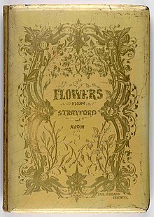 Yellow cover of a book with floral decorations in gold.