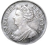 Silver coin showing a depiction of a woman's head and shoulders