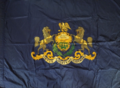 A Pennsylvania state flag that may have been used by a National Guard unit during World War I, depicting a white scroll instead of the red one used today.