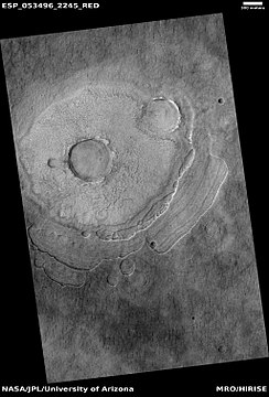 Pedestal crater, as seen by HiRISE under HiWish program. Scallops are forming at the bottom edge of the pedestal.