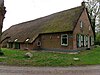 Hallenhuisboerderij 5 Hallenhuisboerderij in ambachtelijk-traditionele stijl met dwarsdeel