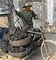 A man hauling material with a bicycle in Vietnam