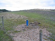 A UK site, capped, with monitoring wells