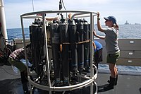 Researchers prepare a CTD-rosette for taking measurements and water samples at the Deep Water Horizon oil spill site.