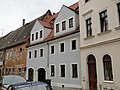 Wohnhaus in geschlossener Bebauung (in Art eines Doppelhauses) mit Seitenflügel im Hof