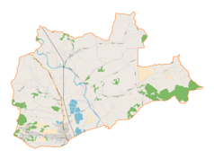 Mapa konturowa gminy Tomice, blisko centrum na lewo u góry znajduje się punkt z opisem „Woźniki”