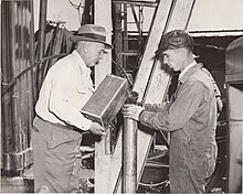 Francis "Tug" Nadeau Irving Filling Torpedo with nitroglycerin