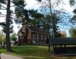 Bethel Lutheran, with a historic pine log on right