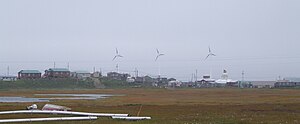 Hooper Bay with wind turbines in background.