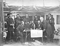 A posed photograph of U.S. Navy officers holding a council of war aboard the Asiatic Squadron flagship, the steam frigate USS Colorado, off Korea in June 1871 prior to the Korean Expedition. Pillsbury, photographed as a master, stands on the left.