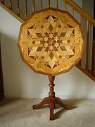 Tip-top table veneered in a parquetry pattern by Isaac Leonard Wise, circa 1934.