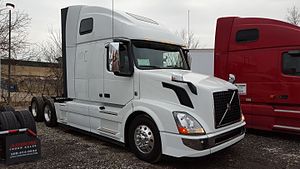 A color photograph of a white Volvo truck