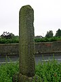 The worn side of the cross.