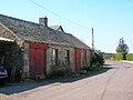 The old Smithy in the mainstreet. The roof on the closest building has since collapsed (2007).