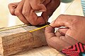 Craftsperson threading traditional beadwork