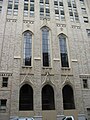 Traces of the Temple Methodist Episcopal Church include the original three entrance doors and decorative windows, designed in the Gothic Revival architecture style